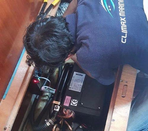 Checking the engine and impeller during boat maintenance