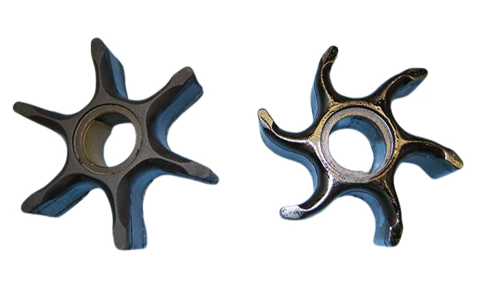 Worn marine impeller next to a new one before impeller replacement